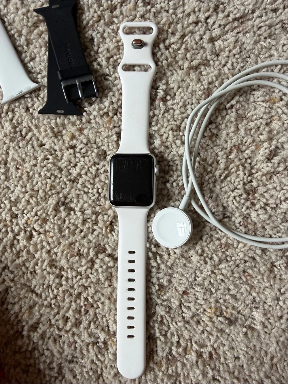 White Apple Watch Series 3 with Extra Bands and Magnetic Charger
